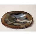 NATURAL AGATE SPECIMEN WITH A HIGHLY POLISHED OVAL SHAPED RECESSED INNER SECTION, WEIGHING 447 GRAM