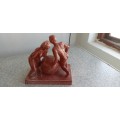 Stunning Solid Sculpture of Woman and Guy with Ball