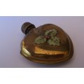 AN ANTIQUE PERFUME BOTTLE IN A METAL SLEEVE ....HEART WITH LADY BUG DETAIL