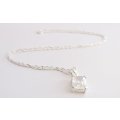 A STERLING SILVER NECKLACE PLUS A STERLING SILVER PENDANT SET WITH A CLEAR FACETED STONE
