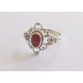 AN EYE CATCHING STERLING SILVER RING SET WITH A RED CENTER ....WHAT A BARGAIN !!