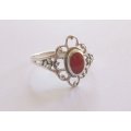 AN EYE CATCHING STERLING SILVER RING SET WITH A RED CENTER ....WHAT A BARGAIN !!