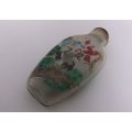 A BEAUTIFUL ORIENTAL GLASS SNUFF BOTTLE WITH WILD BIRD , WATERFALL AND BLOSSOMS DETAIL ....WOW !!