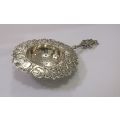 An old solid Dutch silver tea strainer with beautiful detail and applicable stamps