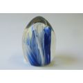 AN EYE CATCHING VINTAGE SOLID GLASS PAPERWEIGHT WITH BLUE AND WHITE LAVA STYLE DETAIL ...WOW !!
