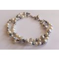 WOW !! AN ELEGANT DOUBLE STRAND GENUINE PEARL BRACELET WITH SOLID STERLING SILVER DESIGNER CLASP !!