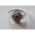 A Fancy Solid Sterling Silver ring set with a red faceted Cubic Zirconia !! No Combining Fees !!