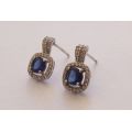 STUNNING !! AN ELEGANT PAIR OF SOLID STERLING SILVER EARRINGS SET WITH FACTED BLUE STONES !! WOW !!