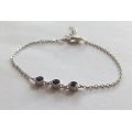 A PETITE YET ELEGANT SOLID STERLING SILVER BRACELET SET WITH 3 FACETED BLUE STONES !! BRAND NEW !!