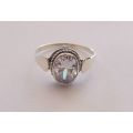 AN EYE CATCHING SOLID STERLING SILVER RING SET WITH A SPARKLY FACETED STONE !! NEVER WORN ...
