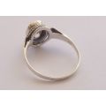 AN EYE CATCHING SOLID STERLING SILVER RING SET WITH A SPARKLY FACETED STONE !! NEVER WORN ...