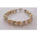 A GENUINE AKOYA PEARL , ROSE QUARTZ AND OTHER FRESHWATER PEARL BRACELET WITH STERLING SILVER CLASP