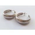 A STYLISH "BIGGISH" PAIR OF SOLID STERLING SILVER EARRINGS ...IN EXCELLENT CONDITION...MUST HAVE !!