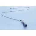 AN ELEGANT FACETED BLUE STONE STERLING SILVER TEARDROP PENDANT WITH DAINTY STERLING SILVER NECKLACE