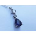 AN ELEGANT FACETED BLUE STONE STERLING SILVER TEARDROP PENDANT WITH DAINTY STERLING SILVER NECKLACE