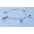 A LOVELY VINTAGE STYLE STERLING SILVER CHARM BRACELET WITH A FEW HOLLOW STARTER CHARMS !! SWEET !!
