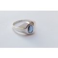 COOL FIND !! A GREAT LOOKING SOLID STERLING SILVER RING SET WITH A FACETED BLUE STONE !! WOW !!