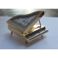 A NOTEWORTHY FIND !! PERFECT GIFT !! A VERY HEAVY FOR SIZE METAL CLOCK IN PIANO FORM WITH BOX !! WOW