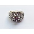 A GORGEOUS SOLID STERLING SILVER RING WITH INTRICATE DETAIL AND A FACETED RED STONE !! WOW !!