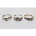 THREE ABSOLUTELY GORGEOUS SOLID STERLING SILVER RINGS SET WITH CUBIC ZIRCONIAS !! BID FOR THE LOT !!