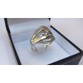 A SOLID STERLING SILVER RING SET WITH A FACETED CZ STONE - FULLY TESTED