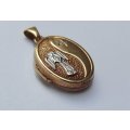A VINTAGE 9CT GOLD "GUARDIAN ANGEL" LOCKET - STAMPED AND TESTED