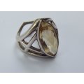 A UNIQUE SOLID STERLING SILVER RING SET WITH A LARGE FACETED STONE - POSSIBLY CITRINE - STAMPED !!