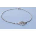 A GENUINE STERLING SILVER BRACELET WITH TREE OF LIFE FEATURE - STAMPED AND TESTED