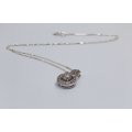 A SOLID STERLING SILVER PENDANT SET WITH FACETED STONES AND A STERLING SILVER NECKLACE -FULLY TESTED