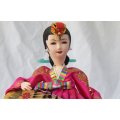 LOOK !! A LOVELY VINTAGE ORIENTAL DOLL IN TRADITIONAL CLOTHING HOLDING A HARP !! RARE IN SA !!