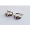 A QUALITY HIGH CLASS SOLID STERLING SILVER HINGED PAIR OF EARRINGS SET WITH DARK AND CLEAR STONES !!