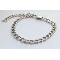 A STRONG VINTAGE  SOLID STERLING SILVER STARTER CHARM BRACELET WITH OVERSIZED CLASP !! WOW !!