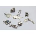 A COOL LOT OF 9 ASSORTED VINTAGE STERLING SILVER CHARMS INCLUDING A DESIGNER PIECE BY WHITE ICE !!