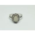 R1 START !! A solid Sterling Silver ring set with a white cabochon stone and faceted stones !! LOOK