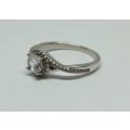 R1 START !! An elegant solid Sterling Silver ring set with faceted clear CZ stones !! FREE COMBINING