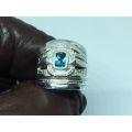 AN EXCEPTIONAL WIDE SOLID STERLING SILVER RING SET WITH A FACETED BLUE STONE IN GREAT CONDITION !!