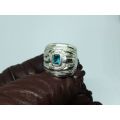 AN EXCEPTIONAL WIDE SOLID STERLING SILVER RING SET WITH A FACETED BLUE STONE IN GREAT CONDITION !!