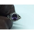 WOW !! A DELIGHTFUL SOLID STERLING SILVER RING SET WITH A FACETED PURPLE STONE !! SUCH A BEAUTY !!