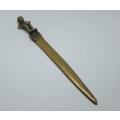 An antique solid brass boy from Bruxelles theme letter opener
