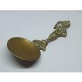 An old solid brass Pixie theme caddy spoon - Combe Martin