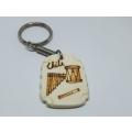 A vintage musical theme keyring from Chile