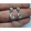 WOW !! A VERY CLASSY PAIR OF STERLING SILVER EARRINGS WITH FACETED CLEAR INSETS !! NEVER WORN !!