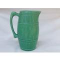 An Art Deco period green barrel jug / vase by Sylvac of England mould number 1435