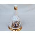 A vintage Bells whisky commemorative decanter made by Wade of England - Fergi & Prince Andrew
