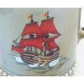 A vintage heavy quality Irish porcelain display jug with galleon motif