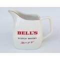 A vintage Bells Scotch whisky advertising jug by Wade of England