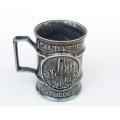 A detailed vintage souvenir mug from the Canterbury Cathedral made by Holkham Pottery of England