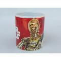 A rare vintage Star Wars collectors coffee mug with droid detail by Kinnerton Pottery