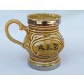A vintage porcelain display jug by Wade of England with ALE motif