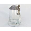 A vintage cut glass tankard with hinged pewter lid